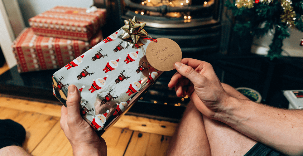 A person holding a wrapped present